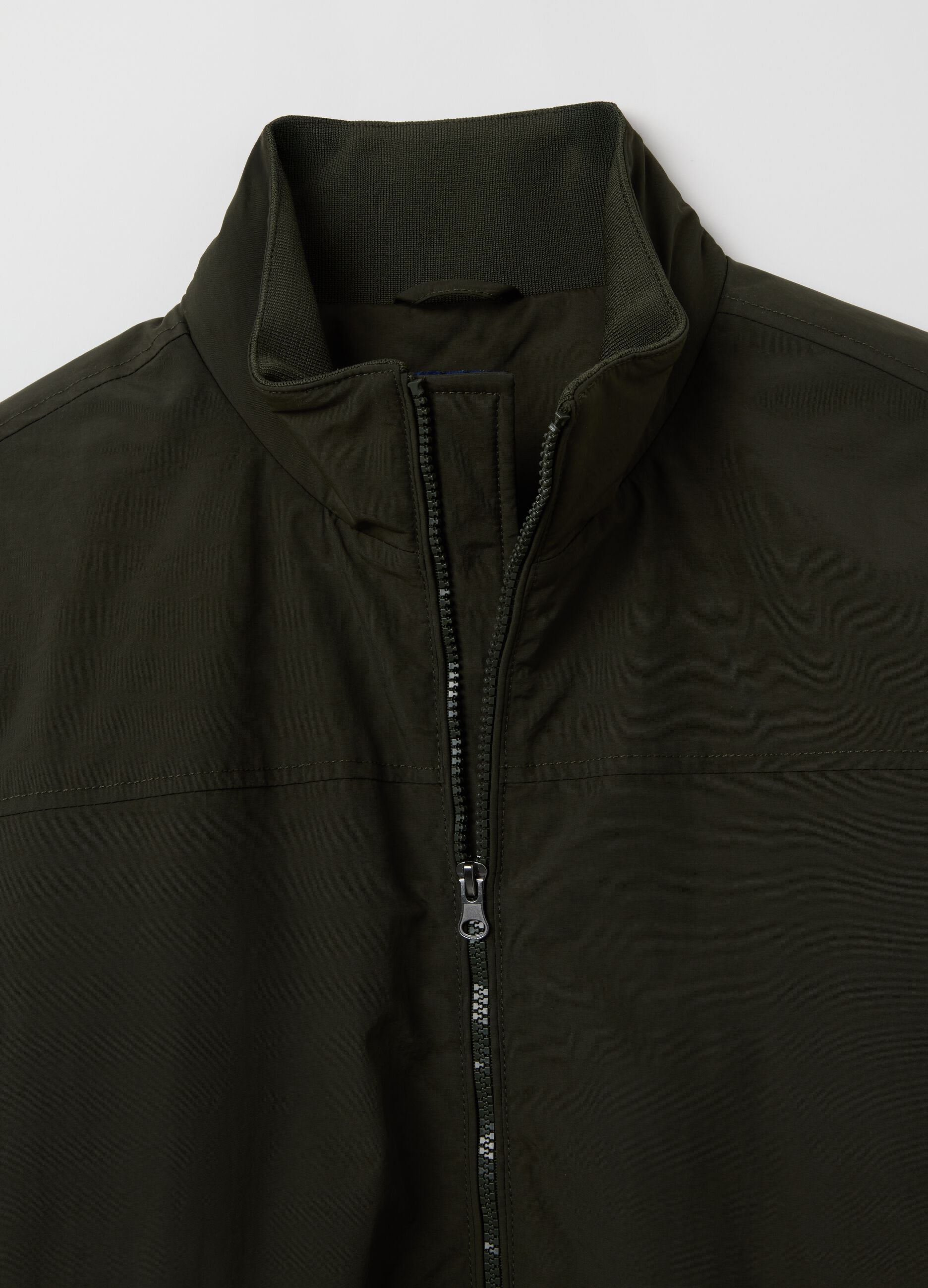 Green padded jacket with zip closure