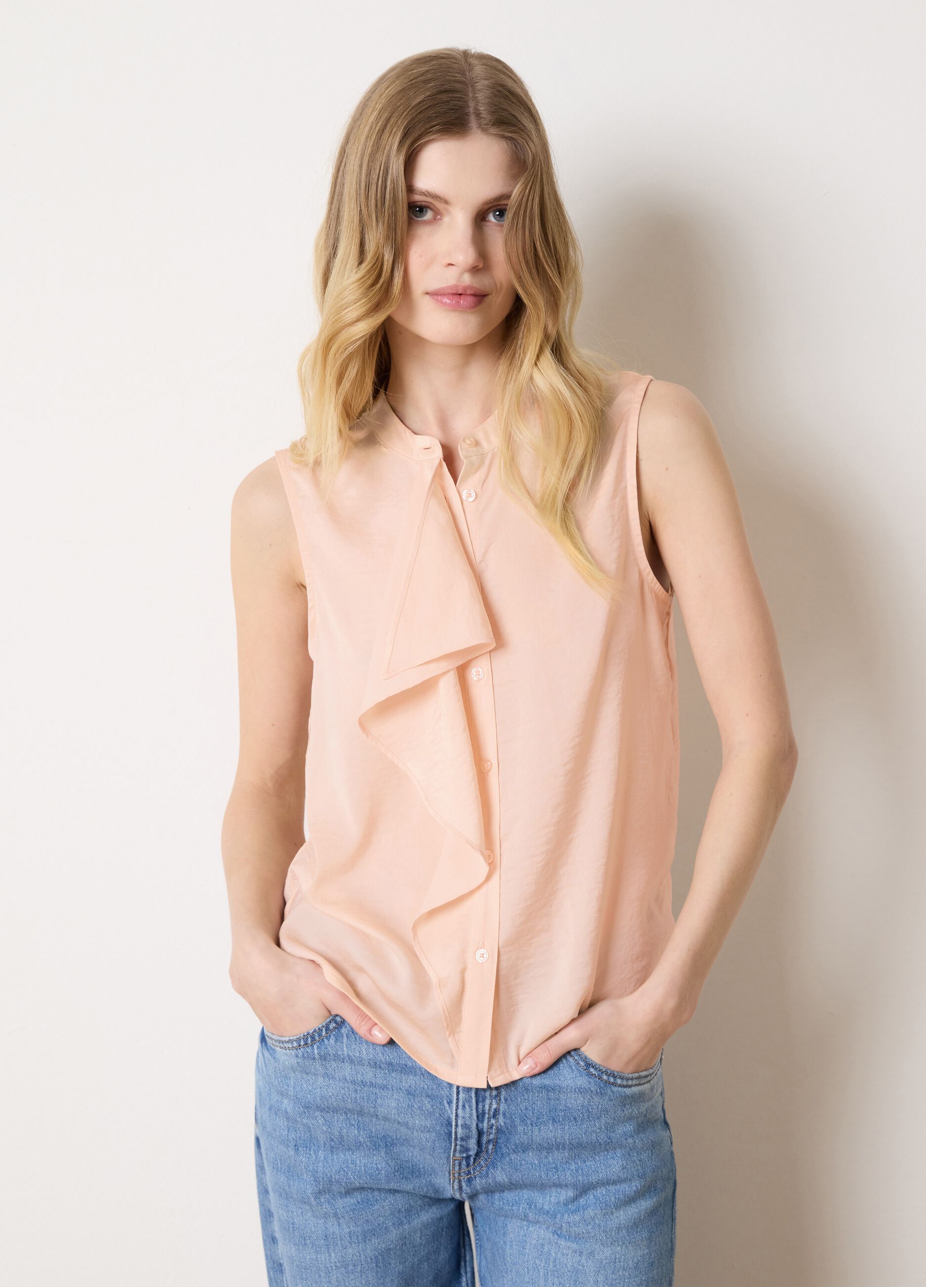 Pink sleeveless blouse with flounce
