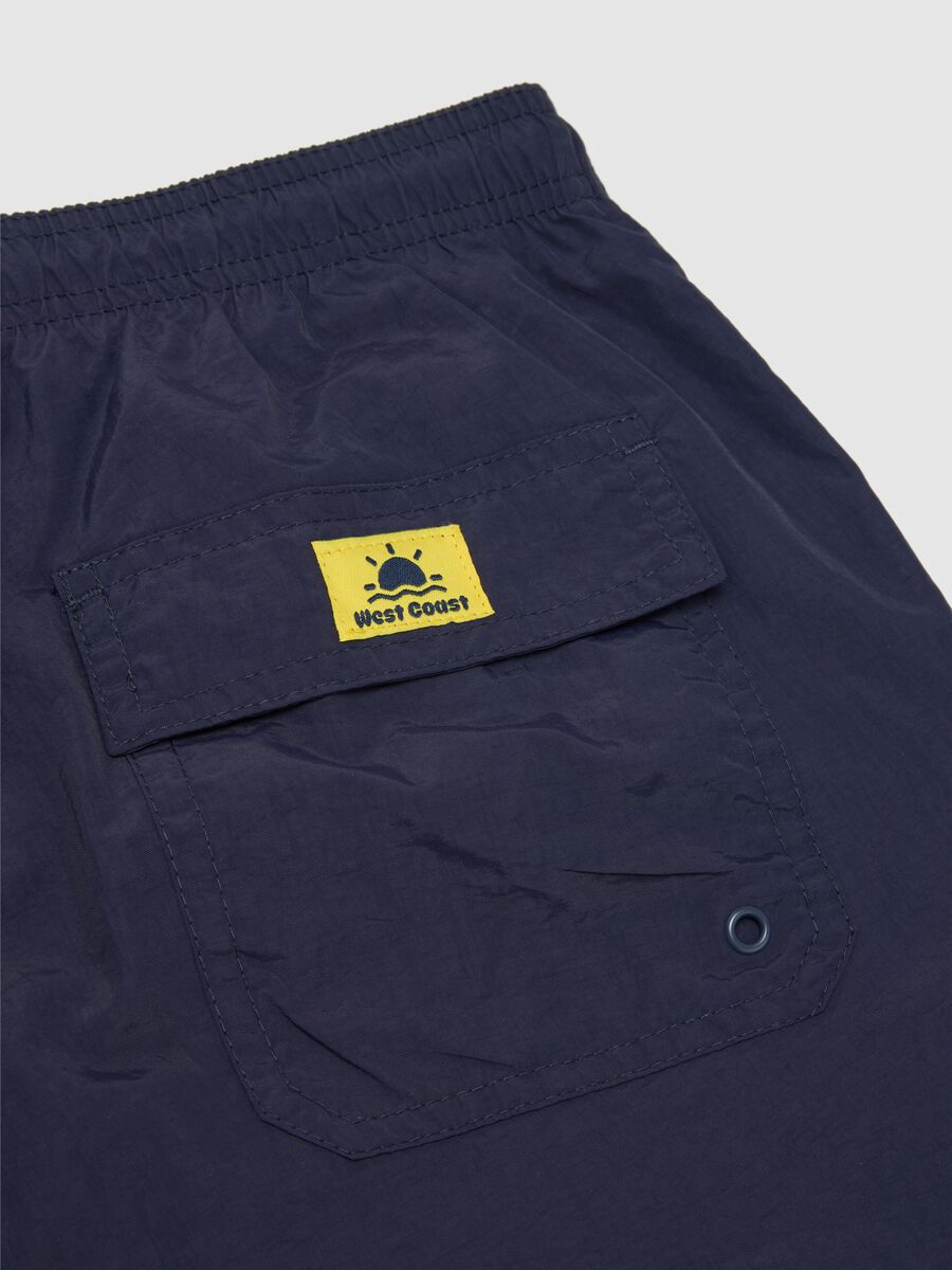 Costume da bagno da uomo blu regular fit con tasca_1
