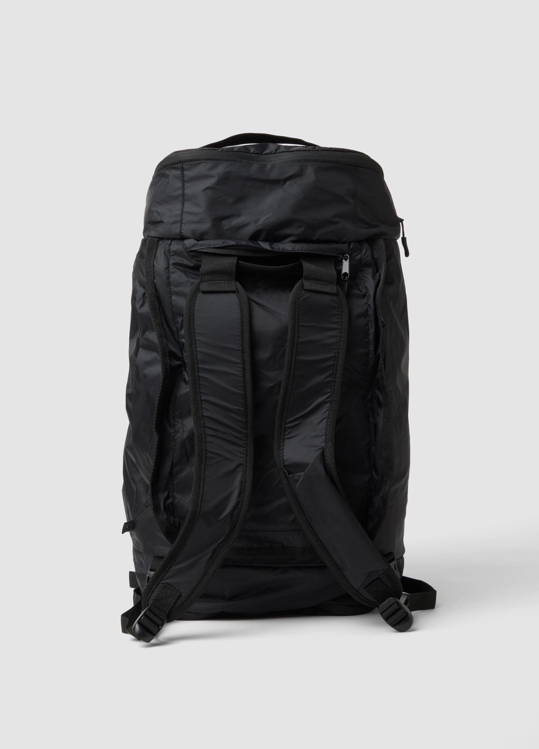 Foldable black sports duffel bag with backpack straps