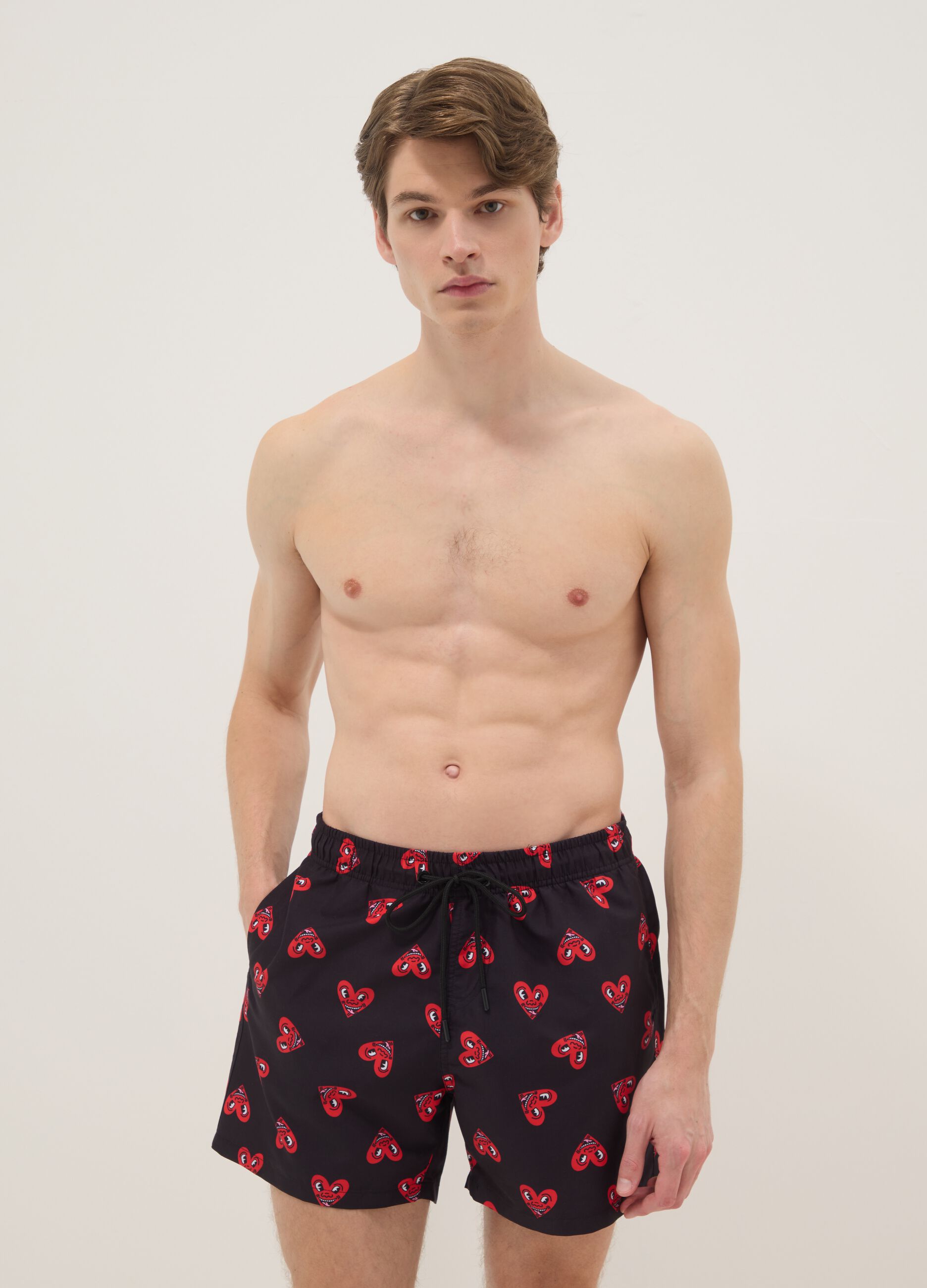 Black beach boxers with Keith Haring heart prints