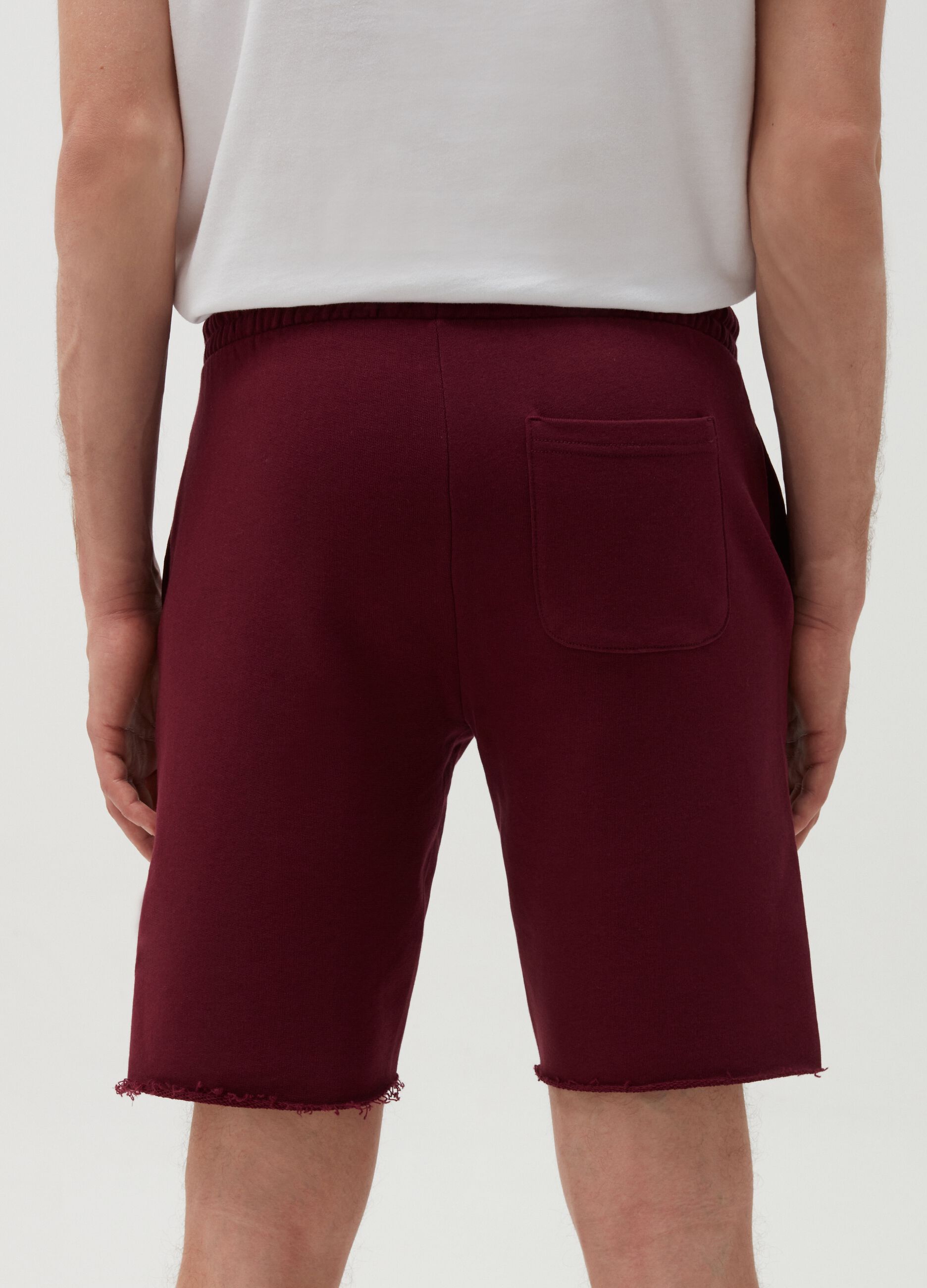 Fleece Bermuda jogging shorts with raw edging