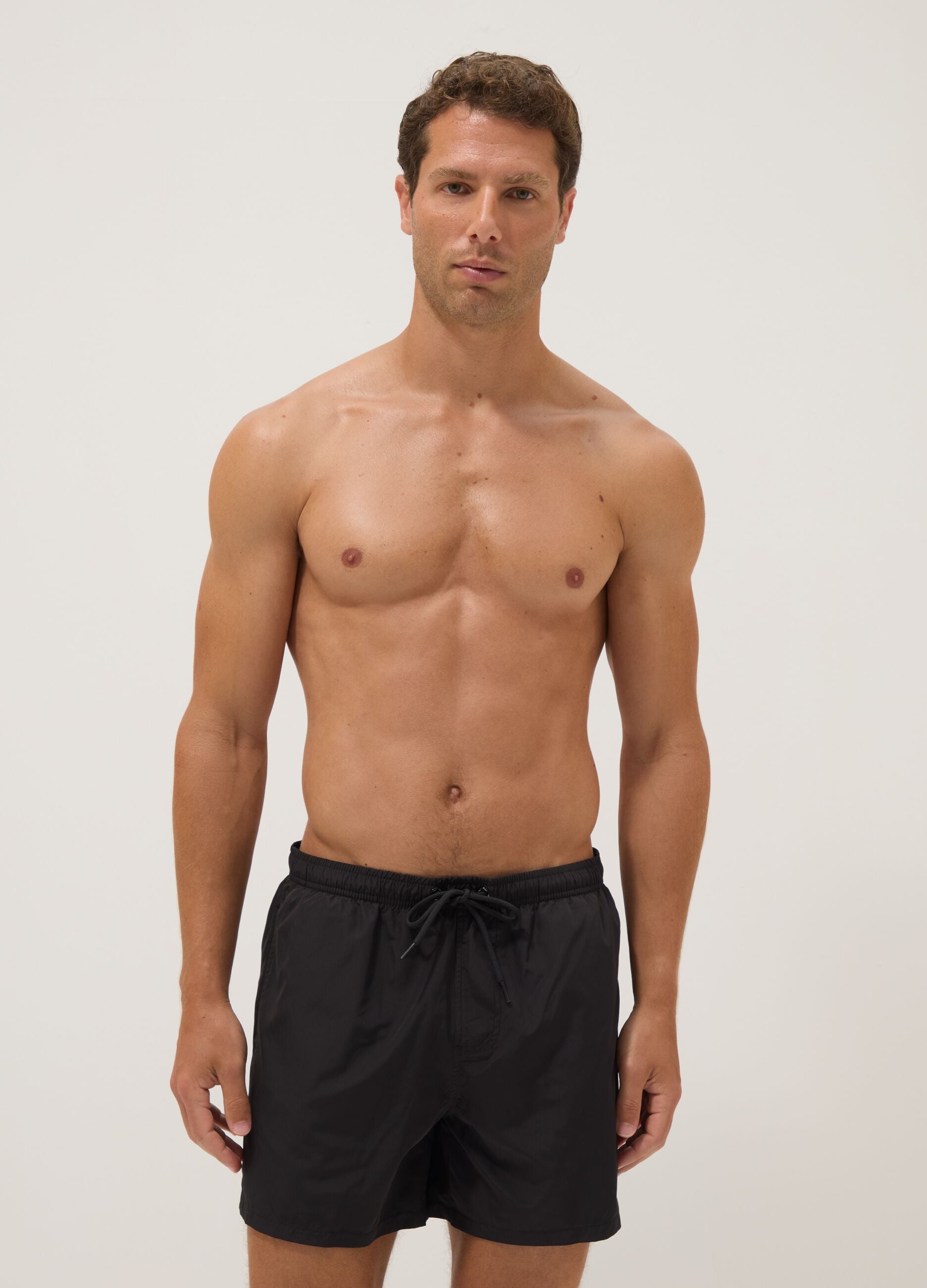 Black swim shorts with elasticated waistband